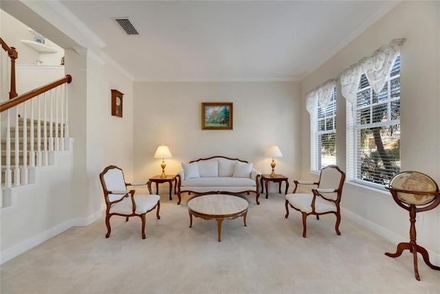 living area featuring light carpet and crown molding