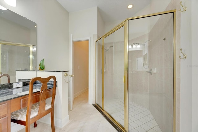 bathroom featuring tile patterned floors and a shower with shower door