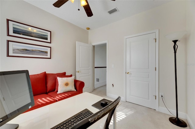 bedroom featuring light colored carpet and ceiling fan