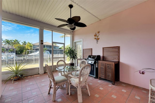 sunroom featuring a wealth of natural light and ceiling fan