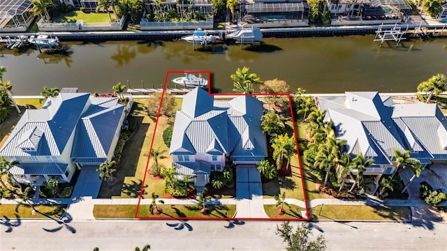 birds eye view of property featuring a water view