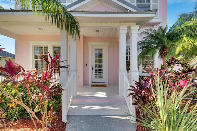 620 Mirabay Blvd, Apollo Beach, FL 33572 - doorway to property with covered porch and stucco siding
