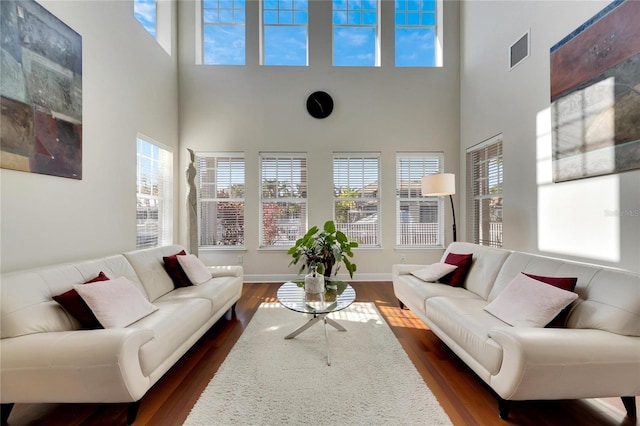620 Mirabay Blvd, Apollo Beach, FL 33572 - living room with healthy amount of natural light, a high ceiling, and dark wood-style floors