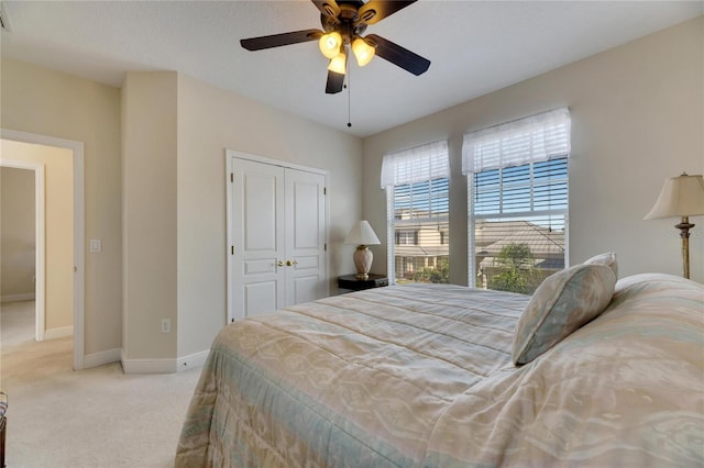 620 Mirabay Blvd, Apollo Beach, FL 33572 - bedroom with light colored carpet, a closet, and ceiling fan