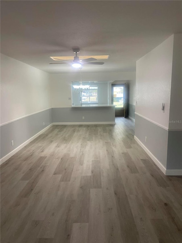 unfurnished room featuring wood-type flooring and ceiling fan