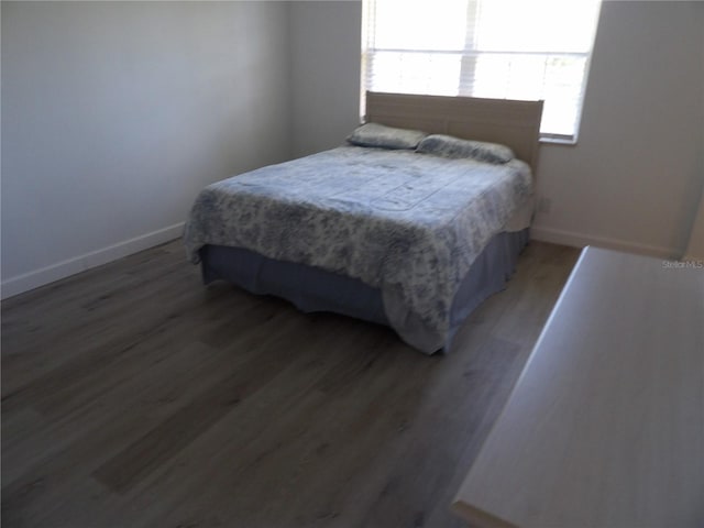 3259 Hilary Cir Unit 1A, Palm Harbor, FL 34684 - bedroom with wood finished floors and baseboards