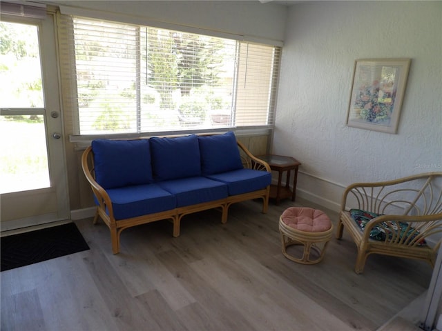 3259 Hilary Cir Unit 1A, Palm Harbor, FL 34684 - sitting room with wood finished floors