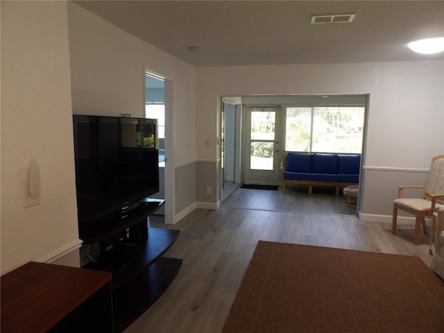 3259 Hilary Cir Unit 1A, Palm Harbor, FL 34684 - entryway with healthy amount of natural light and light wood-style flooring