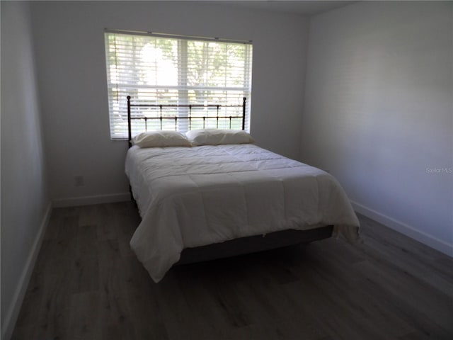 3259 Hilary Cir Unit 1A, Palm Harbor, FL 34684 - bedroom with wood finished floors and baseboards
