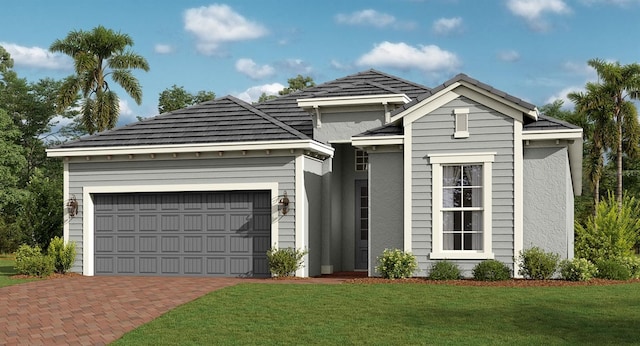 view of front of house featuring a garage and a front lawn