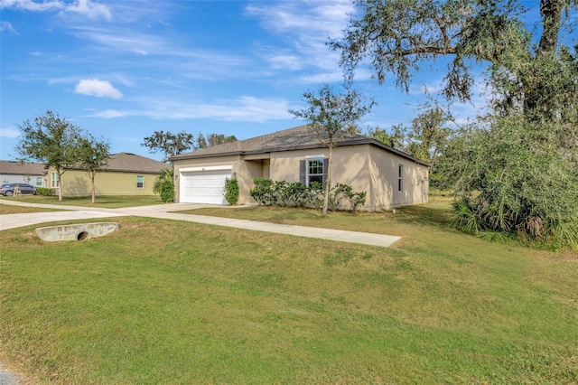 view of front of property with a garage and a front yard