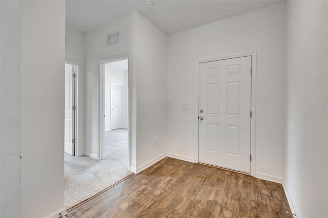 foyer entrance with hardwood / wood-style flooring