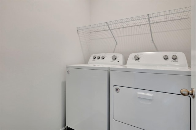 washroom featuring washer and dryer