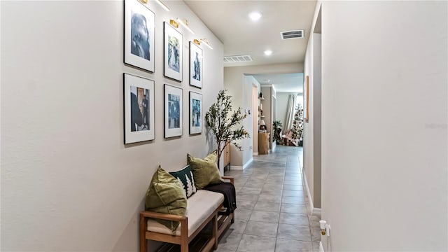 hallway with light tile patterned flooring