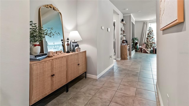 hallway featuring light tile patterned flooring