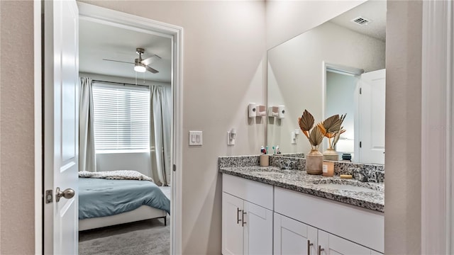 bathroom featuring vanity and ceiling fan