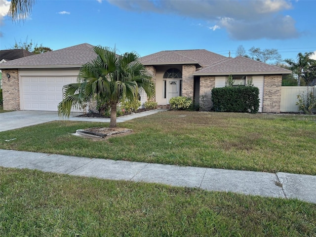 view of front facade featuring a front lawn and a garage