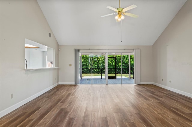 unfurnished living room with hardwood / wood-style floors, high vaulted ceiling, and ceiling fan