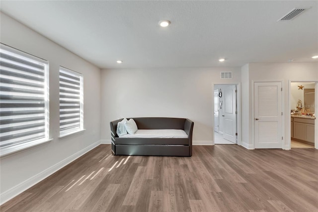 sitting room with hardwood / wood-style floors