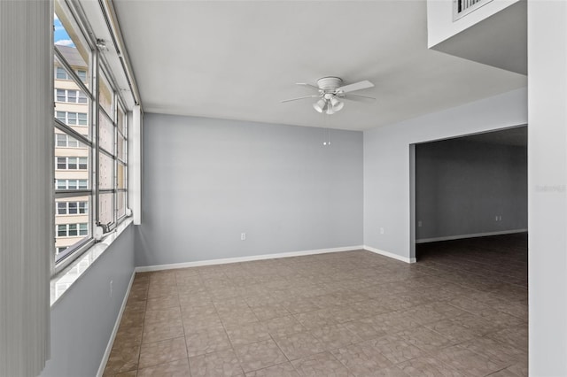 unfurnished room featuring ceiling fan