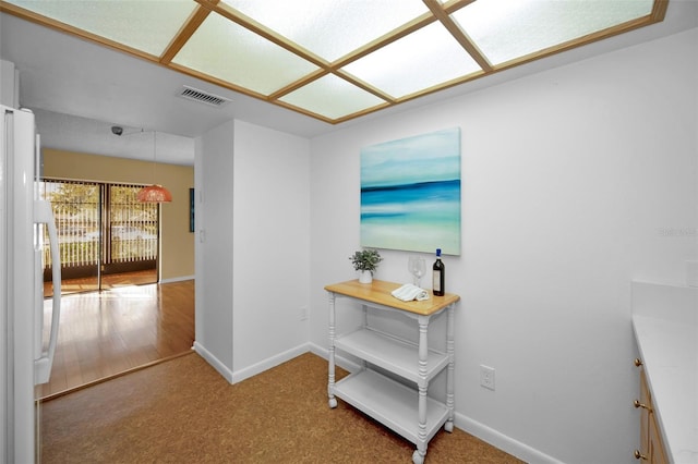 hallway with carpet floors