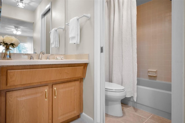 full bathroom featuring vanity, tile patterned floors, ceiling fan, toilet, and shower / tub combo