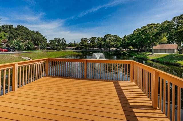 wooden deck with a water view