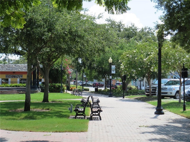 view of property's community with a lawn