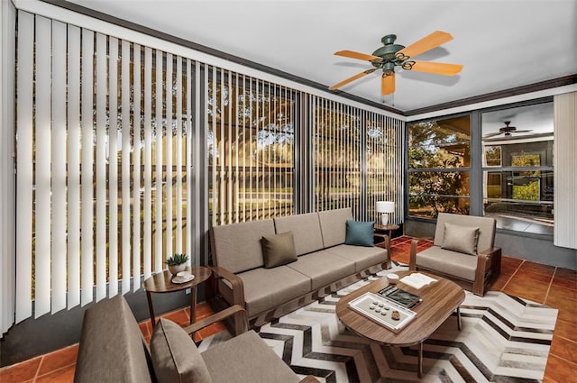 sunroom featuring ceiling fan