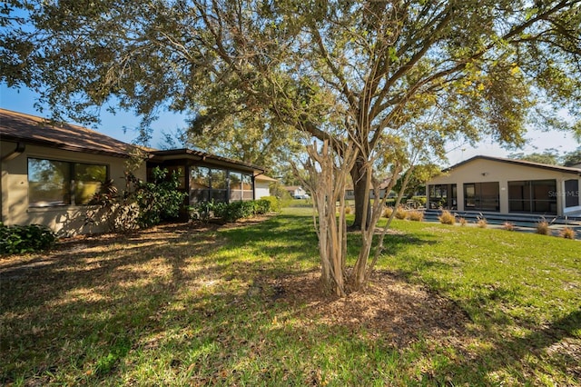 view of yard with a sunroom