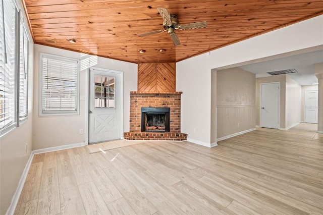 unfurnished living room with ceiling fan, light hardwood / wood-style floors, wood ceiling, and a brick fireplace