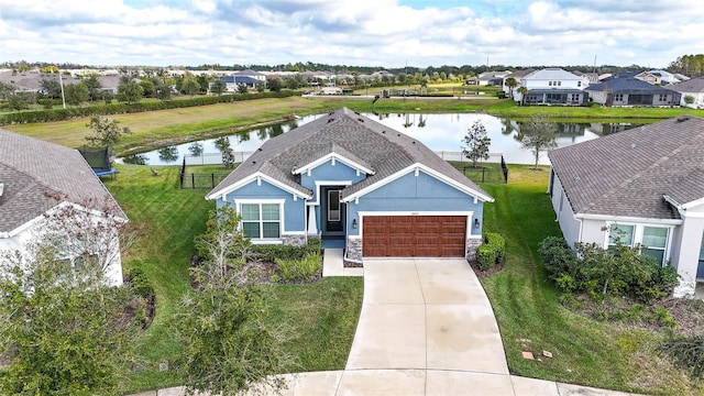 birds eye view of property with a water view