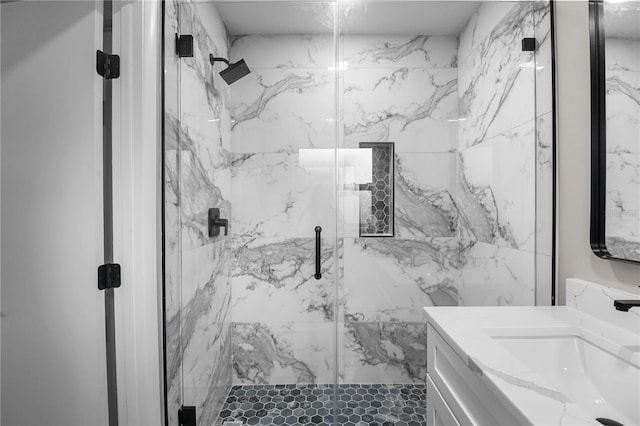 bathroom featuring vanity and an enclosed shower