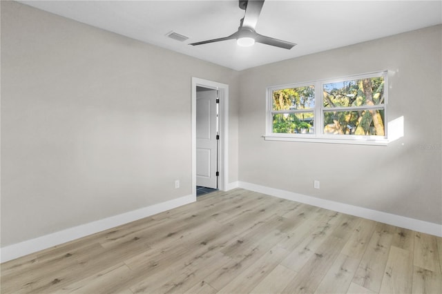 unfurnished room with ceiling fan and light wood-type flooring