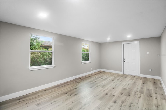 spare room featuring light wood-type flooring