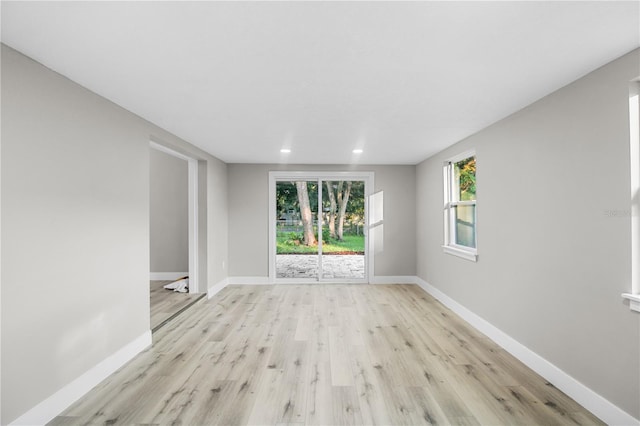 spare room with light hardwood / wood-style floors