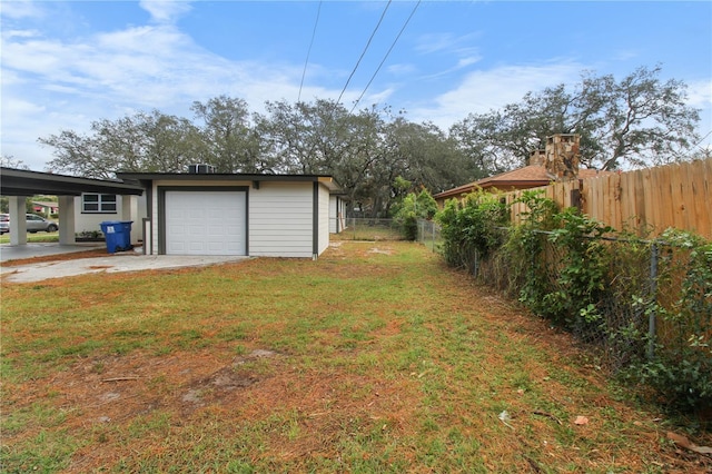 view of yard with an outdoor structure and a garage