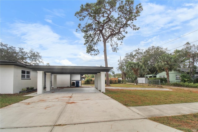 exterior space with a carport