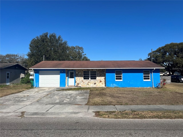 single story home with a garage