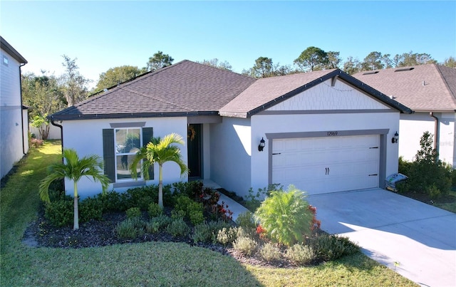 single story home with a front yard and a garage