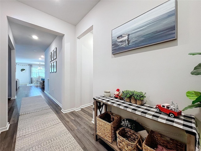 hall with hardwood / wood-style flooring