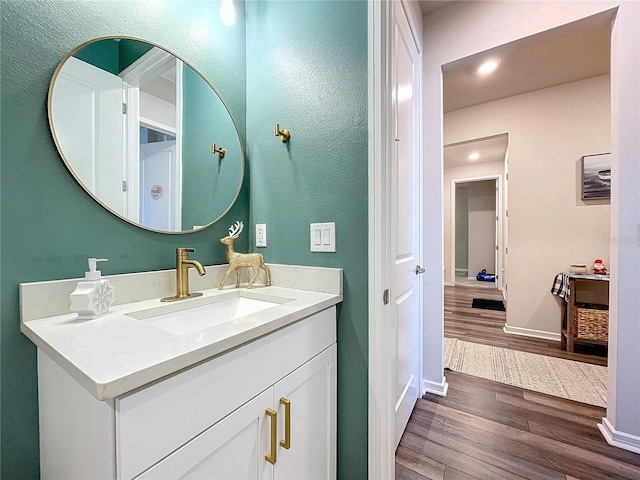 bathroom featuring hardwood / wood-style floors and vanity