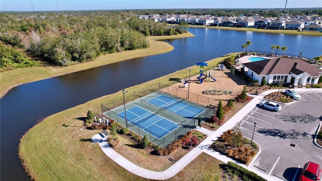 birds eye view of property with a water view