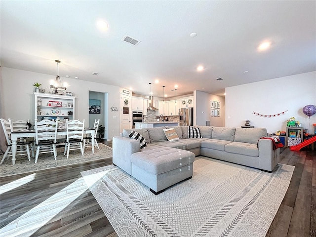 living room featuring dark hardwood / wood-style floors