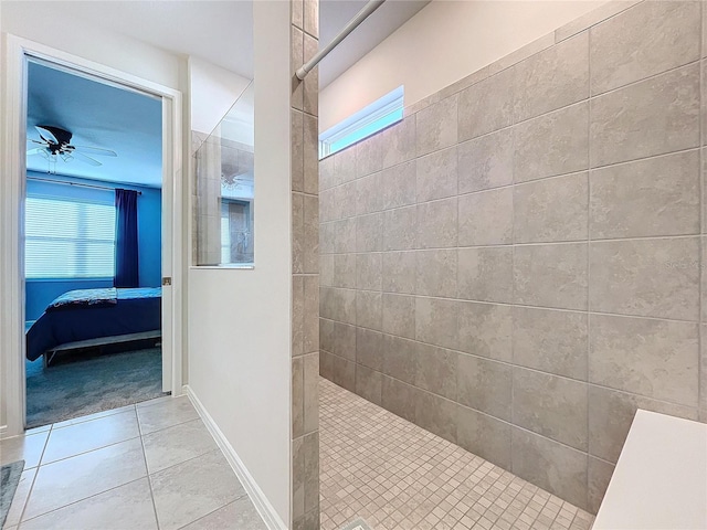 bathroom with tile patterned floors, a shower, and ceiling fan