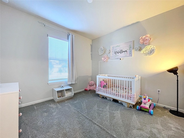 bedroom featuring carpet floors and a nursery area