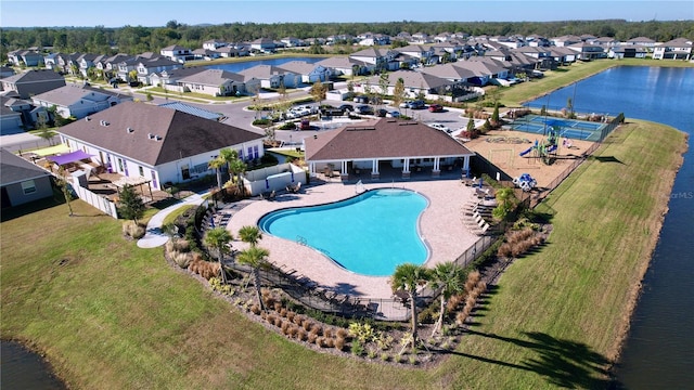 view of pool featuring a water view