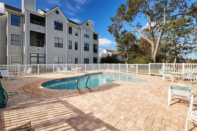 view of pool featuring a patio