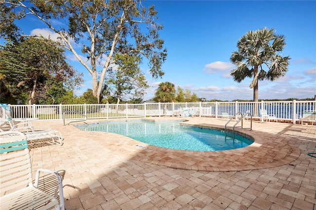 view of swimming pool featuring a patio area