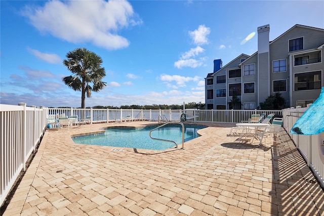 view of swimming pool featuring a patio